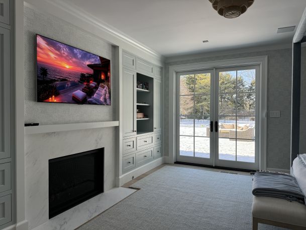 Luxury Living Room with Built-In Entertainment and Scenic Winter View